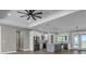 Living space offering stainless appliances, a gray island, and a view to the patio at 16305 Branco Dr, Punta Gorda, FL 33955