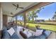 Inviting patio featuring comfortable seating and serene views of the surrounding yard and neighborhood at 16305 Branco Dr, Punta Gorda, FL 33955