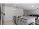 Kitchen island featuring granite countertops and a stainless steel sink at 2784 Dode Ave, North Port, FL 34288
