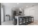 Kitchen island with granite countertops and bar seating at 2784 Dode Ave, North Port, FL 34288