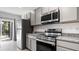 Kitchen features stainless steel appliances and granite countertops at 2784 Dode Ave, North Port, FL 34288