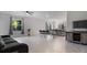 The living room has a ceiling fan, tile flooring, and neutral-colored walls at 2784 Dode Ave, North Port, FL 34288