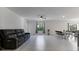 This bright living space offers tile floors, neutral paint, and a ceiling fan at 2784 Dode Ave, North Port, FL 34288