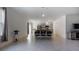 Open-concept living room and kitchen with tile flooring and stainless steel appliances at 2784 Dode Ave, North Port, FL 34288