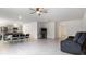 Bright and airy open living space with gray tile floors and neutral walls at 2784 Dode Ave, North Port, FL 34288