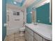 Bathroom features a shower-tub combo and a modern vanity at 3341 Briant St, North Port, FL 34287