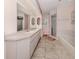 This bathroom features a double sink vanity, shower, and tub at 3341 Briant St, North Port, FL 34287