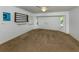 Bright bedroom with carpet, large windows, and shelving, ready for customization at 3341 Briant St, North Port, FL 34287