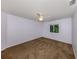 Well-lit bedroom featuring a ceiling fan and neutral brown carpeting at 3341 Briant St, North Port, FL 34287