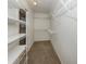 Walk-in closet boasts ample shelving for optimal storage solutions at 3341 Briant St, North Port, FL 34287