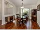 Bright dining room with wood floors, natural light from windows, and elegant decor at 3341 Briant St, North Port, FL 34287