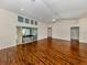 Bright and spacious living room with hardwood floors and large windows, including a sliding glass door at 3341 Briant St, North Port, FL 34287
