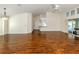 Bright living room with wooden floors, ceiling fan, and neutral paint, perfect for entertaining at 3341 Briant St, North Port, FL 34287