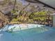 Screened-in pool area features a built-in hot tub and plenty of seating at 3341 Briant St, North Port, FL 34287