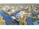 Stunning aerial view of a waterfront home with a private boat dock and access to beautiful canals at 4297 Nettle Rd, Port Charlotte, FL 33953
