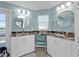 Bathroom with dual sinks, granite countertops and charming under cabinet seating at 4297 Nettle Rd, Port Charlotte, FL 33953