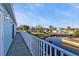 Long waterfront deck with white railing, offering views of the canal and surrounding neighborhood at 4297 Nettle Rd, Port Charlotte, FL 33953