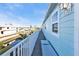 A long blue waterfront deck with white railing, offering views of the canal at 4297 Nettle Rd, Port Charlotte, FL 33953