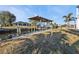 Private boat dock on the water with lush grass leading to the pier at 4297 Nettle Rd, Port Charlotte, FL 33953