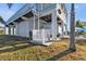 Elevated waterfront home featuring a convenient lift, covered parking and boat trailer at 4297 Nettle Rd, Port Charlotte, FL 33953