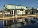 Waterfront home with a metal roof, dock, and outdoor space perfect for enjoying waterfront living at 4297 Nettle Rd, Port Charlotte, FL 33953