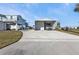 Detached garage featuring a gravel driveway and ample room for parking multiple vehicles at 4297 Nettle Rd, Port Charlotte, FL 33953