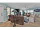 Well-lit living room with leather furniture, decorative accents, and a relaxing ambiance at 4297 Nettle Rd, Port Charlotte, FL 33953