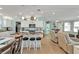 Open-concept living space connects the kitchen and living room, complete with barstool seating at 4297 Nettle Rd, Port Charlotte, FL 33953
