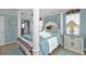 Serene main bedroom with a four-poster bed, soft colors, and lots of natural light at 4297 Nettle Rd, Port Charlotte, FL 33953