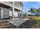 Outdoor patio area with seating and a large covered parking area on a sunny day at 4297 Nettle Rd, Port Charlotte, FL 33953