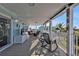 Covered porch with comfortable seating and views of the surrounding landscape at 4297 Nettle Rd, Port Charlotte, FL 33953
