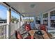 Covered porch with outdoor dining and lounge area at 4297 Nettle Rd, Port Charlotte, FL 33953