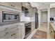 Well-equipped kitchen boasts stainless steel appliances, sleek countertops, and ample cabinet space at 5221 Almar Dr, Punta Gorda, FL 33950