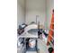 Small storage room with a gas grill, some tools, and other miscellaneous items at 5221 Almar Dr, Punta Gorda, FL 33950