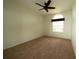 Neutral bedroom with plush carpet, a ceiling fan, and a window at 8242 Lakeside Dr, Englewood, FL 34224