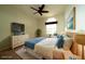 Cozy bedroom with coastal design, wicker furniture, and bright window at 8242 Lakeside Dr, Englewood, FL 34224