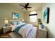 Bright bedroom features a television, coastal decor, and wicker accents at 8242 Lakeside Dr, Englewood, FL 34224