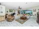 Spacious living room featuring neutral walls, hardwood floors, and abundant natural light at 8242 Lakeside Dr, Englewood, FL 34224