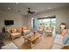 Spacious living room with neutral walls and wicker furniture at 8242 Lakeside Dr, Englewood, FL 34224
