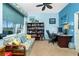 Comfortable office space with daybed, desk, and blue accent wall at 8242 Lakeside Dr, Englewood, FL 34224