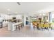 Open-concept kitchen, dining, and living space with bright, neutral tones and plenty of natural light at 9368 Sunbeam Cir, Punta Gorda, FL 33950