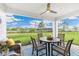 Covered patio with ceiling fan, table with four chairs, and outdoor lounge seating at 9374 Sunbeam Cir, Punta Gorda, FL 33950