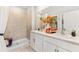Bathroom with dual sinks, tiled shower, ample counter space, and modern fixtures for a luxurious feel at 9452 Sunbeam Cir, Punta Gorda, FL 33950
