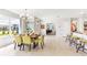 Chic dining area adjacent to a modern kitchen with large windows offering ample natural light at 9452 Sunbeam Cir, Punta Gorda, FL 33950