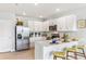 Well-lit kitchen features stainless steel appliances, ample counter space, and bright white cabinetry at 9452 Sunbeam Cir, Punta Gorda, FL 33950