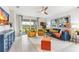 Bright living room features stylish furniture, decor, and sliding glass doors leading to outdoor space at 9452 Sunbeam Cir, Punta Gorda, FL 33950