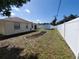 Large fenced backyard featuring a shed and landscaping area, perfect for outdoor enjoyment and privacy at 1057 Staley St, Port Charlotte, FL 33952