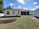 Backyard with a shed, screened in porch, and partial fence at 1057 Staley St, Port Charlotte, FL 33952
