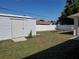 Spacious backyard featuring a shed and partial fencing at 1057 Staley St, Port Charlotte, FL 33952