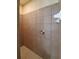 Bathroom featuring a walk-in tile shower with updated fixtures at 1057 Staley St, Port Charlotte, FL 33952